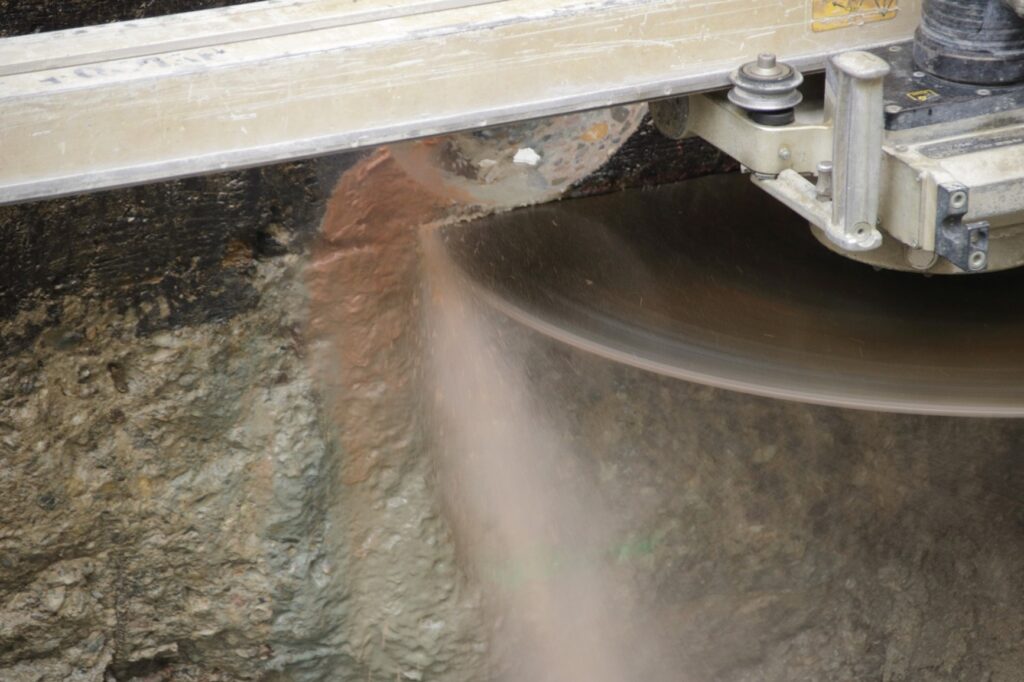 A circular saw cutting a rock