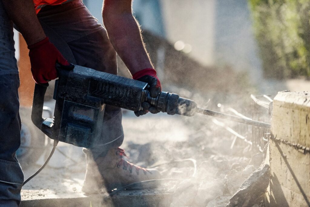 A person using a jackhammer