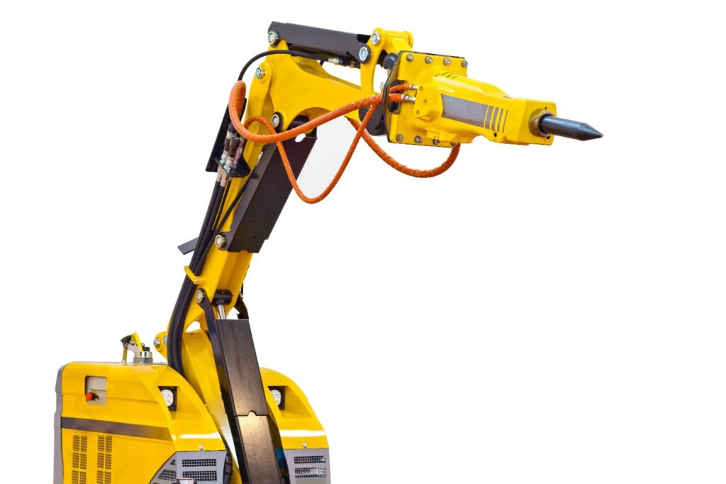 A yellow robotic demolition machine